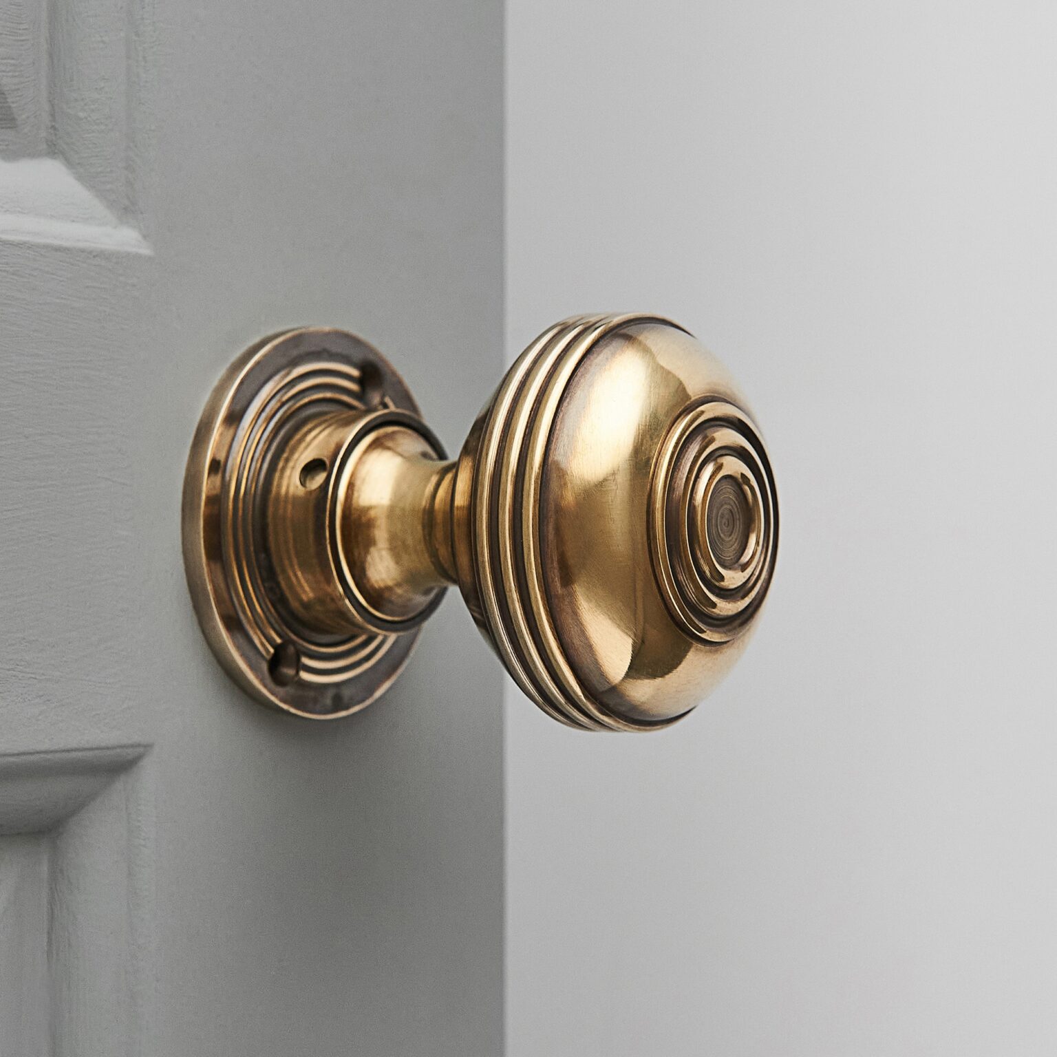 Large Bloxwich Regency Style Door Knobs in Aged Brass